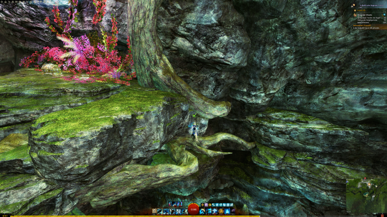 Mit einem beherzten Gleitsprung um die Ecke, kommt ihr auf dem Felsen an.